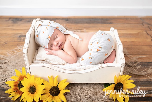 Baby in Bed with Sunflowers