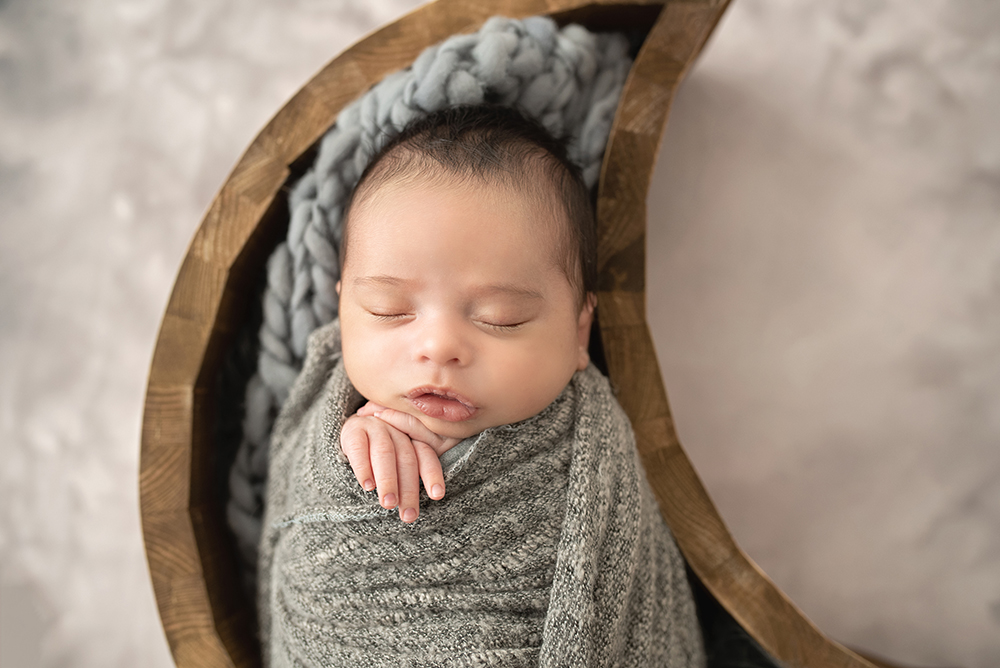Studio Newborn Photography Baby in Wrap and Moon Basket